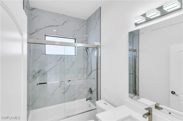 full bathroom with toilet, combined bath / shower with glass door, and vanity