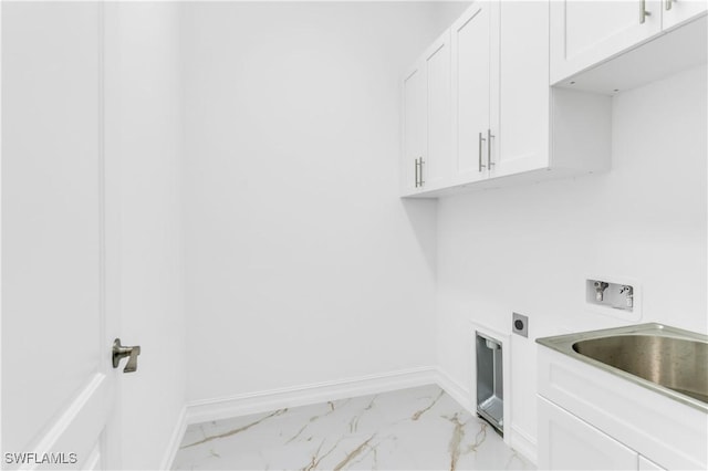 laundry area featuring electric dryer hookup, hookup for a washing machine, and cabinets