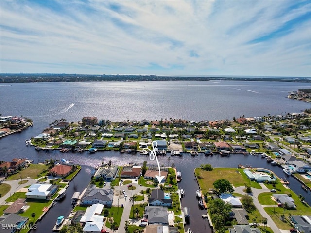 birds eye view of property featuring a water view