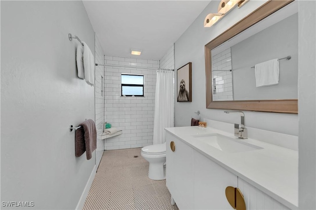 bathroom with tile patterned flooring, toilet, walk in shower, and vanity