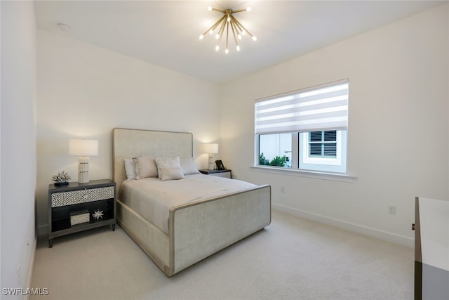 bedroom featuring baseboards, a notable chandelier, and light colored carpet