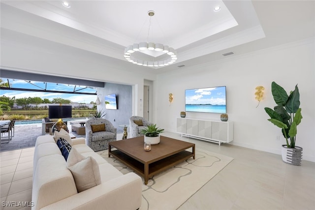 living room featuring crown molding, a raised ceiling, visible vents, a sunroom, and tile patterned floors