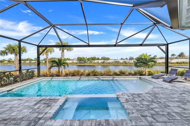 view of pool with a water view, a patio area, a pool with connected hot tub, and a lanai