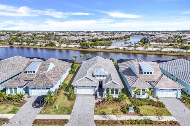 aerial view with a water view and a residential view