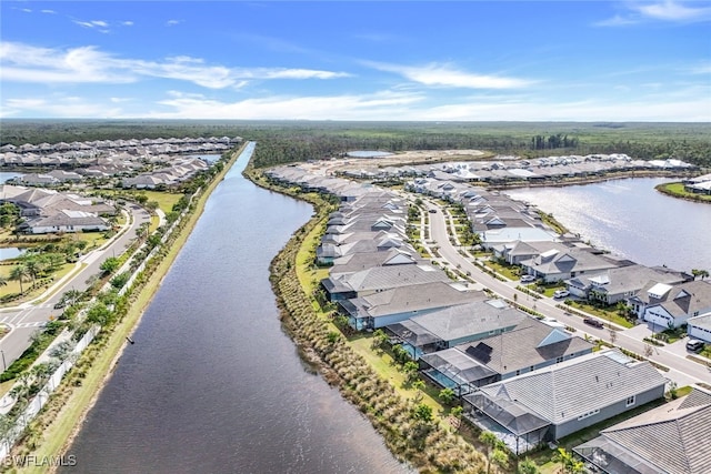 aerial view featuring a residential view and a water view