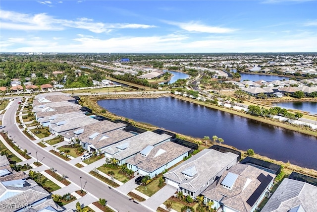 birds eye view of property featuring a water view and a residential view