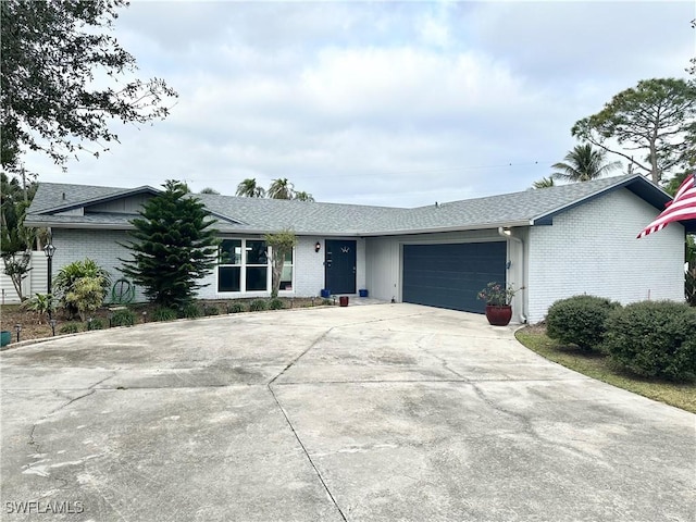 ranch-style house featuring a garage