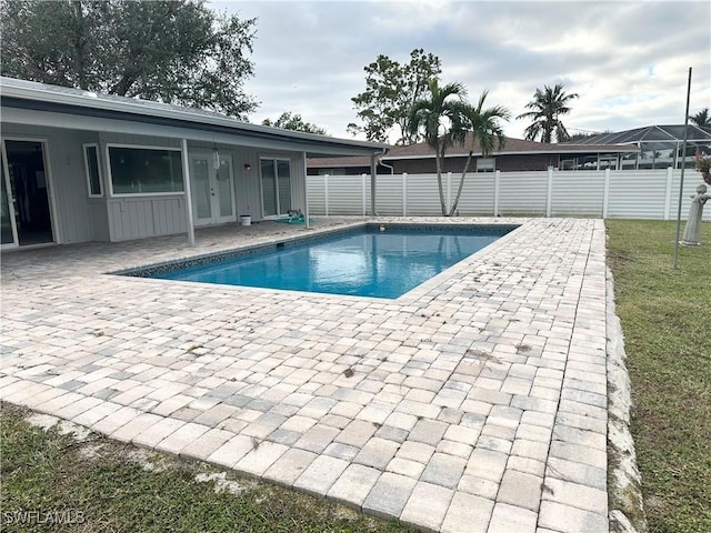 view of swimming pool with a patio area