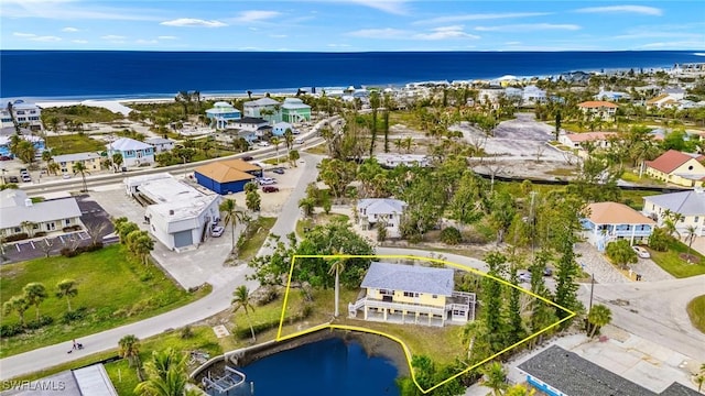 aerial view with a water view and a residential view