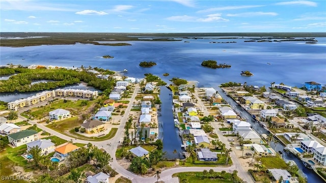 bird's eye view with a water view and a residential view