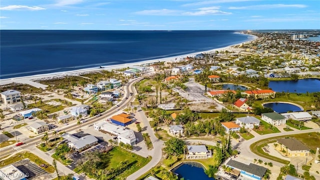 bird's eye view featuring a water view, a residential view, and a view of the beach