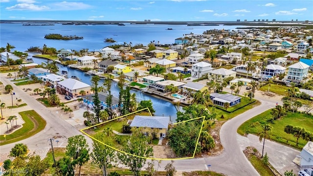 aerial view with a water view and a residential view