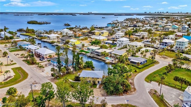 bird's eye view featuring a residential view and a water view