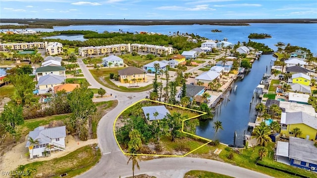 bird's eye view featuring a water view and a residential view