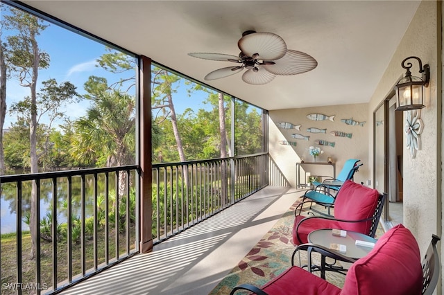 sunroom featuring a wealth of natural light and ceiling fan