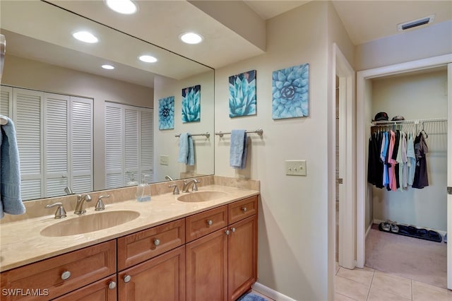 bathroom featuring tile patterned floors and vanity