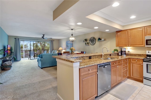 kitchen with white appliances, sink, ceiling fan, light colored carpet, and kitchen peninsula