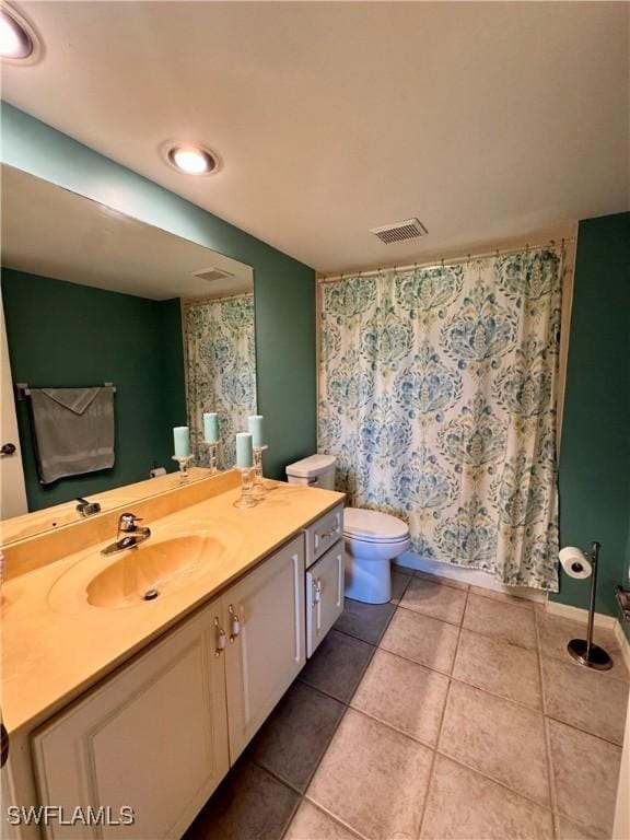 bathroom with walk in shower, tile patterned flooring, vanity, and toilet