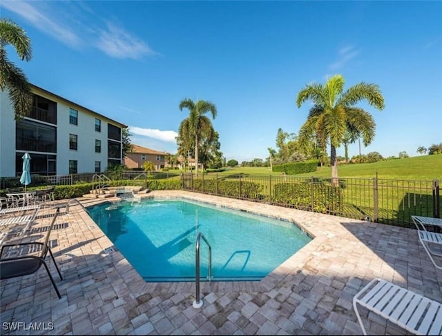 view of swimming pool featuring a patio area