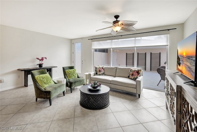 living room featuring light tile patterned floors and ceiling fan