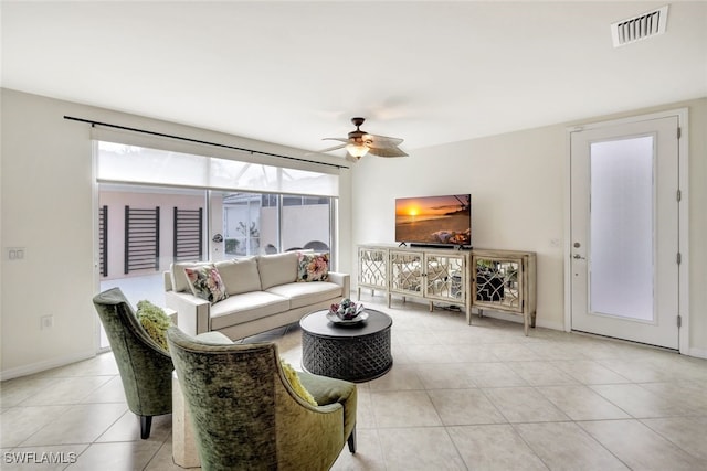 living room with ceiling fan and light tile patterned floors