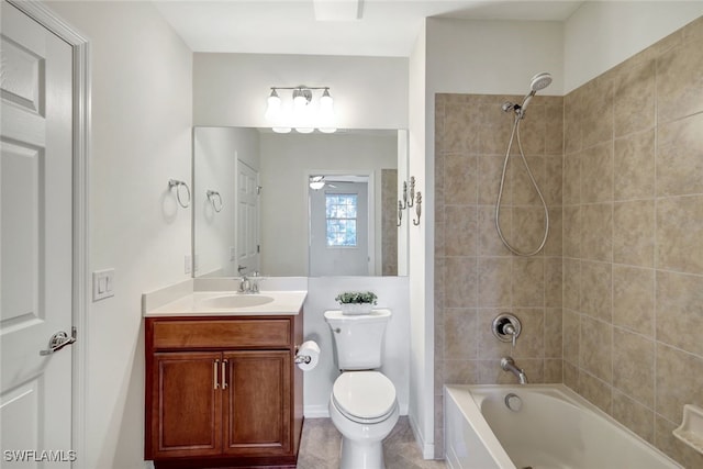 full bathroom featuring toilet, tiled shower / bath, vanity, ceiling fan, and tile patterned flooring