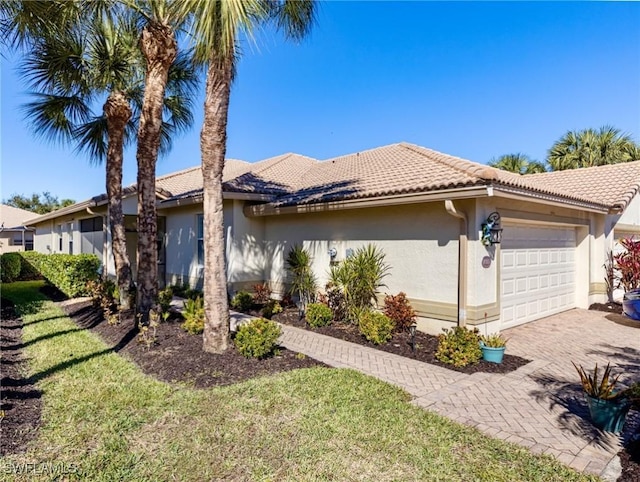 view of front facade with a front lawn and a garage