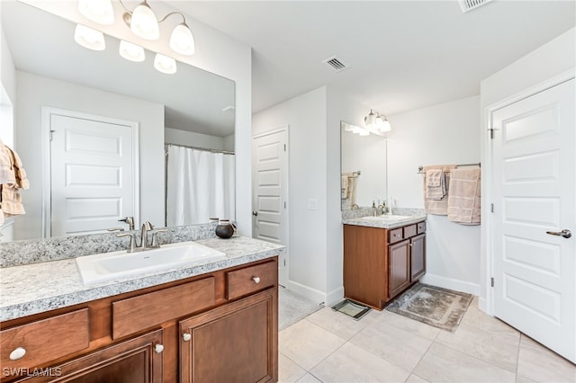 bathroom featuring vanity and tile patterned floors