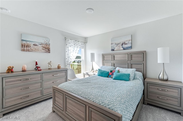 bedroom with light colored carpet