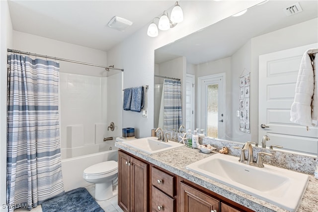 full bathroom with vanity, toilet, and shower / bath combo with shower curtain