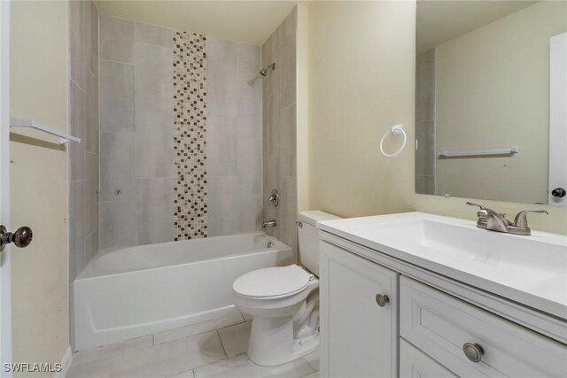 full bathroom featuring vanity, tile patterned floors, tiled shower / bath combo, and toilet