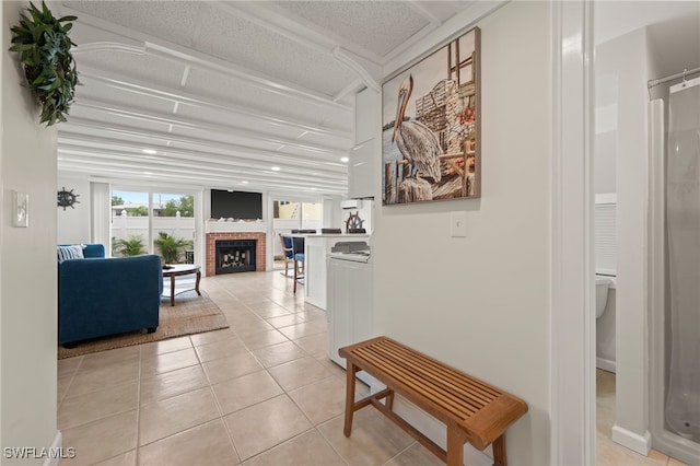 hall featuring light tile patterned floors