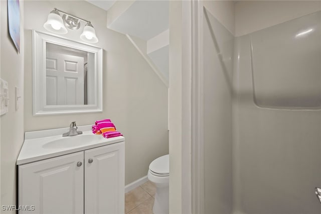 bathroom featuring tile patterned floors, vanity, and toilet