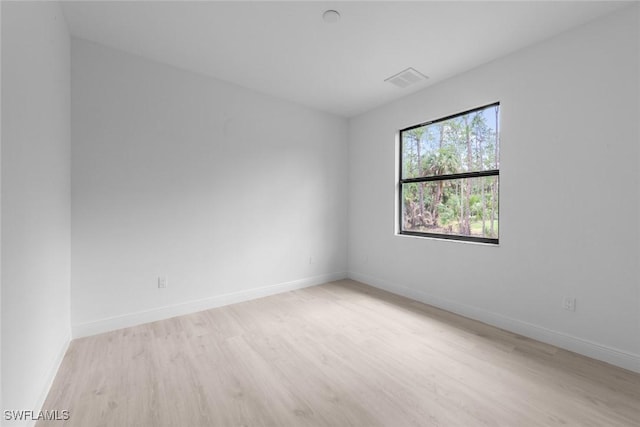 unfurnished room featuring light wood-type flooring