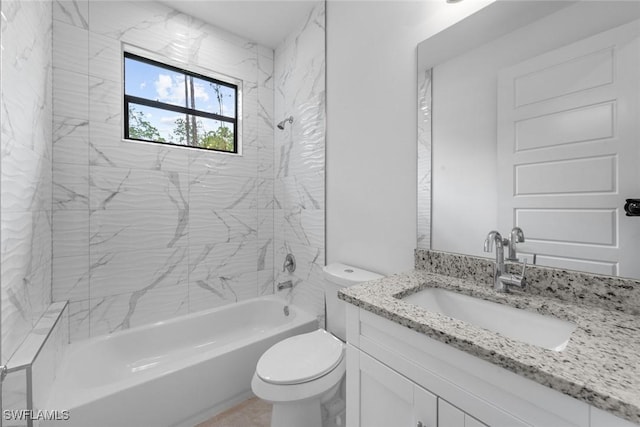 full bathroom with vanity, toilet, and tiled shower / bath