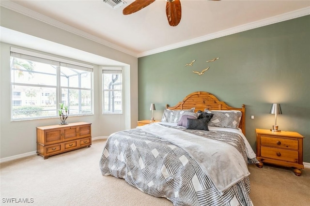 bedroom featuring ceiling fan, light colored carpet, and ornamental molding