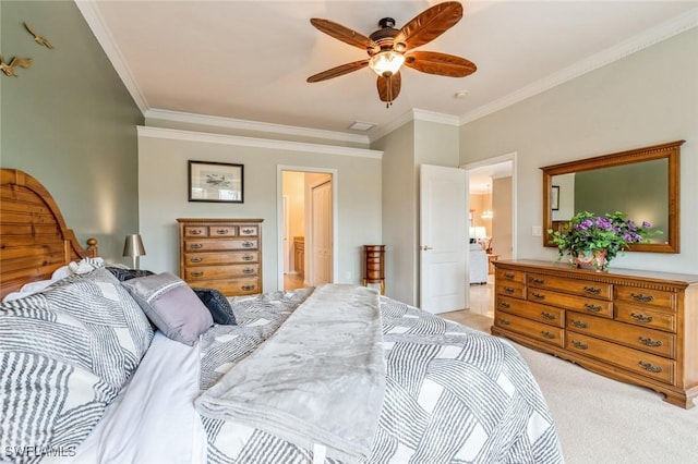 bedroom with ceiling fan, ornamental molding, carpet floors, and ensuite bath