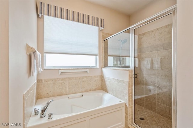 bathroom with separate shower and tub