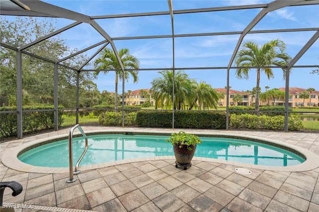 view of pool with a lanai and a patio