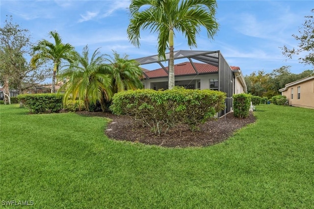 view of yard with a lanai