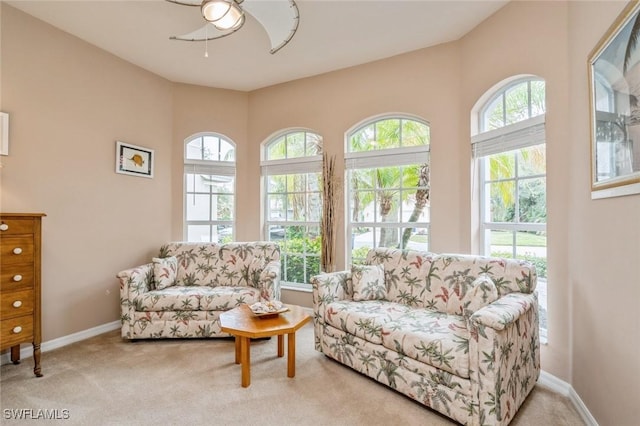 living room featuring ceiling fan and light carpet