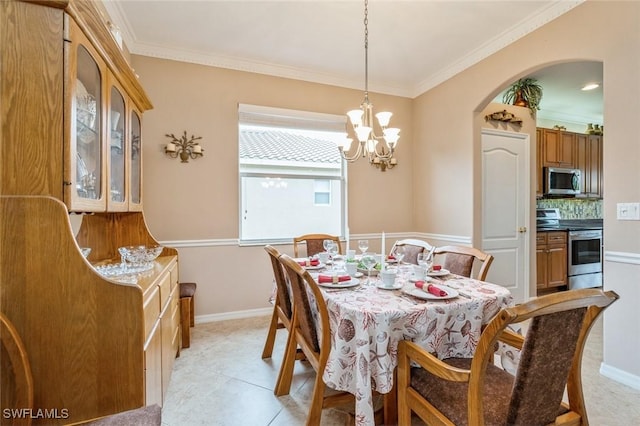 tiled dining space with a chandelier and ornamental molding