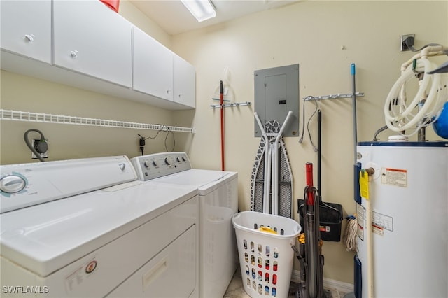 clothes washing area featuring washer and dryer, cabinets, electric panel, and water heater