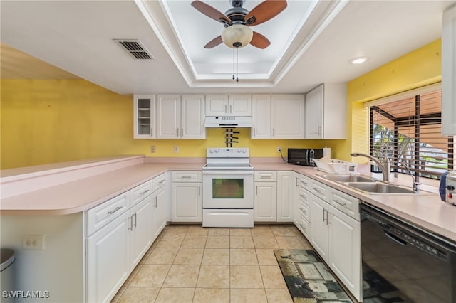 kitchen with a tray ceiling, sink, white cabinets, and black appliances