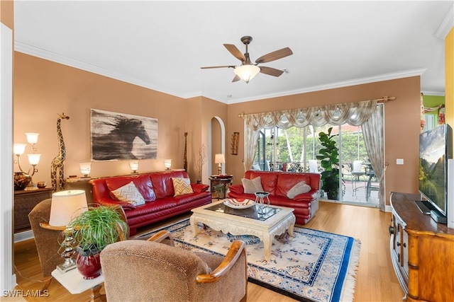 living room with light wood-type flooring, ceiling fan, and crown molding