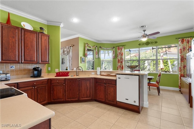 kitchen with kitchen peninsula, ceiling fan, crown molding, sink, and dishwasher