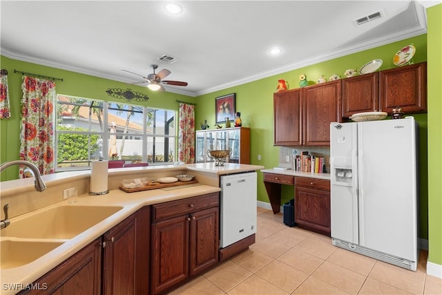 kitchen featuring light tile patterned flooring, white appliances, sink, and ornamental molding