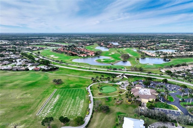 aerial view with view of golf course and a water view