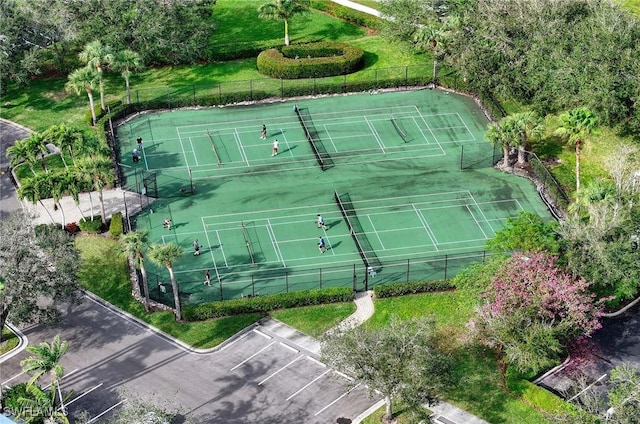 view of tennis court featuring fence