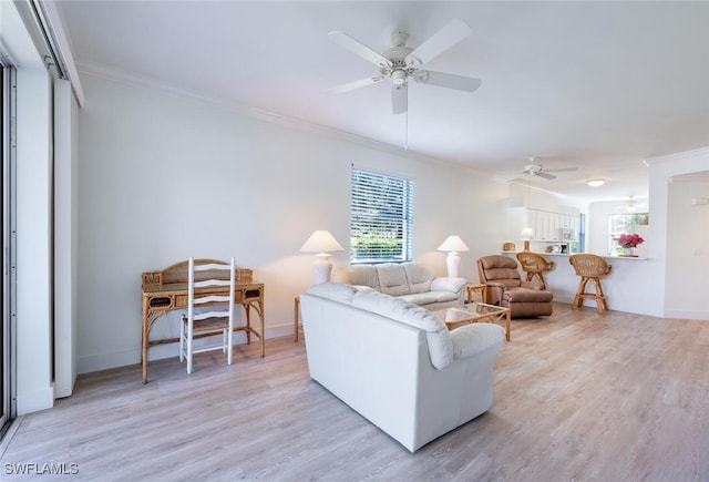 living room with ceiling fan, light hardwood / wood-style floors, and ornamental molding